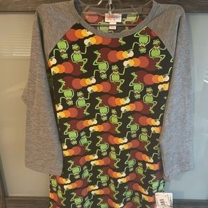2- Lularoe Randy shirts. Disney print NWT and pink gently used.